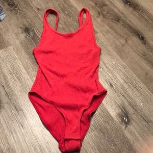 Red body suite. Out from under